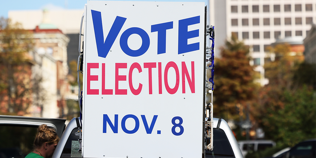 A voting sign is seen before a Democratic Senate Candidate Raphael Warnock (D-GA) Get Out the Vote rally at Bearfoot Tavern on November 07, 2022, in Macon, Georgia. 