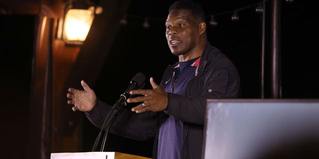 Georgia Republican U.S. Senate candidate Herschel Walker speaks during a campaign rally on Nov. 28, 2022 in Cumming, Georgia.