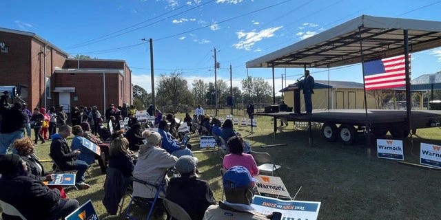 Georgia Democratic Sen. Raphael Warnock speaks to supporters at a rally in Fort Valley, Ga., Thursday ahead of a December election runoff against Republican Herschel Walker.