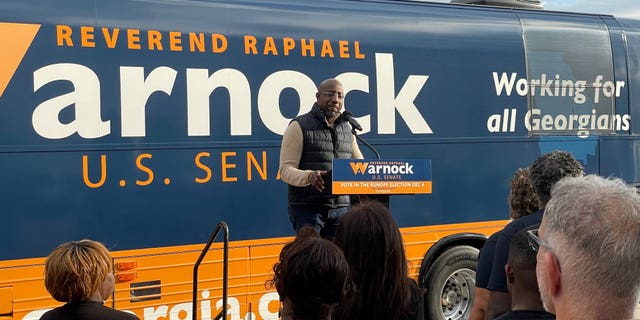 Democratic Georgia Sen. Raphael Warnock speaks to supporters at a campaign rally in Tifton, Georgia on November 29, 2022.