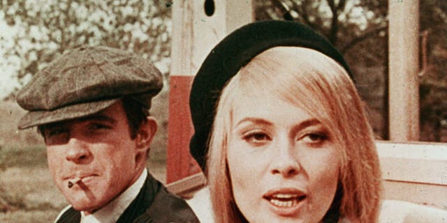 Warren Beatty and Faye Dunaway sit in a car in a still from the 1967 film "Bonnie And Clyde" directed by Arthur Penn.