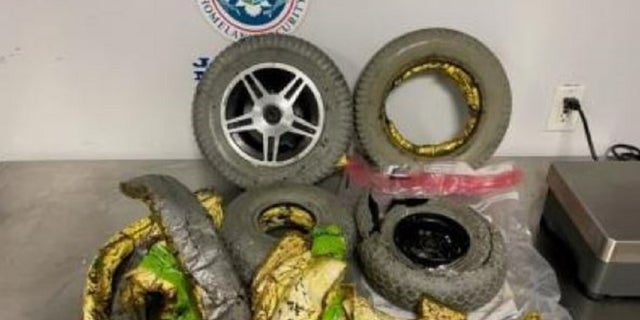 A woman tried smuggling $450,000 worth of cocaine in the wheels of her wheelchair in New York City, authorities said.