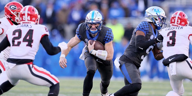 Will Levis of the Kentucky Wildcats carries the ball against the Georgia Bulldogs at Kroger Field on November 19, 2022, in Lexington, Ky.