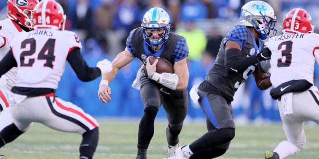 Will Levis of the Kentucky Wildcats carries the ball against the Georgia Bulldogs at Kroger Field Nov. 19, 2022, in Lexington, Ky.