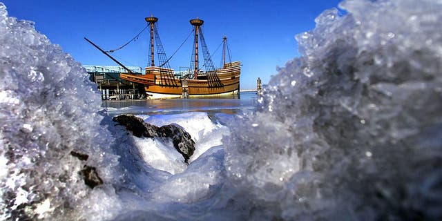 Plymouth, Massachusetts, January 22: Ice-covered rocks frame the Mayflower ll at its berth in Plymouth Harbor, frozen in place by ice-covered waters as the wind was blowing over 25 mph over the water, with the temperature in the low teens. The Pilgrims landed in Plymouth in late December 1620, at the start of a typically brutal Massachusetts winter.