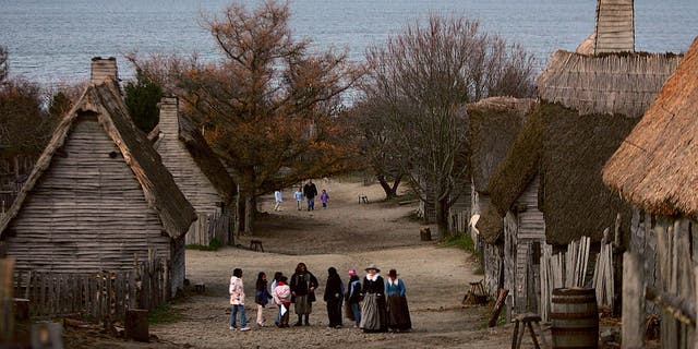 People visit the 1627 Pilgrim Village at Plimoth Plantation where role-players portray Pilgrims seven years after the arrival of the Mayflower. The 17th century replica village was the site of the first Thanksgiving in 1621. Thanksgiving Day was established as a national holiday by President Abraham Lincoln in 1863; it's celebrated on the last Thursday of November.  