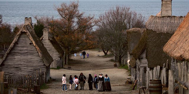 People visit the 1627 Pilgrim Village at Plimoth Plantation where role-players portray Pilgrims seven years after the arrival of the Mayflower. The 17th century replica village was the site of the first Thanksgiving in 1621. Thanksgiving Day was established as a national holiday by President Abraham Lincoln in 1863; it's celebrated on the last Thursday of November.  