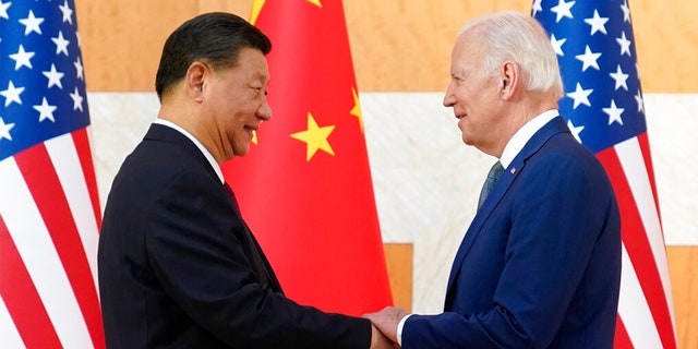 President Biden, right, and Chinese President Xi Jinping shake hands before their meeting on the sidelines of the G20 summit meeting, Monday, Nov. 14, 2022, in Nusa Dua, in Bali, Indonesia. 