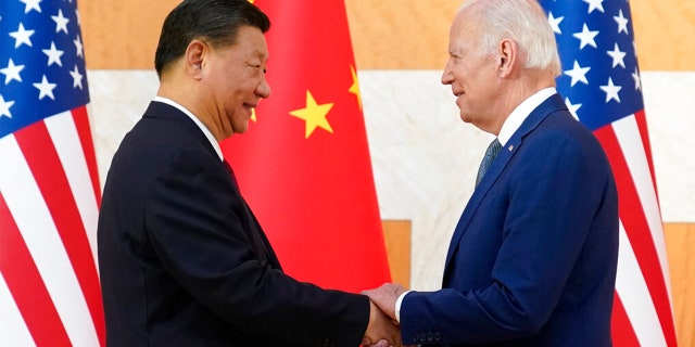 President Joe Biden, right, and Chinese President Xi Jinping shake hands before their meeting on the sidelines of the G20 summit, Nov. 14, 2022, in Nusa Dua, Bali, Indonesia.