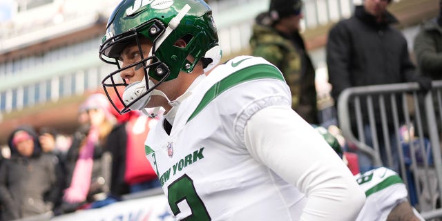 New York Jets quarterback Zach Wilson, #2, runs onto the field for warm up before the game against the New England Patriots at Gillette Stadium in Foxborough, Massachusetts, Nov. 20, 2022.