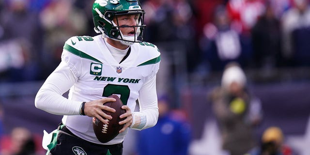 New York Jets quarterback Zach Wilson, #2, looks to pass against the New England Patriots in the first quarter at Gillette Stadium in Foxborough, Massachusetts, Nov. 20, 2022.