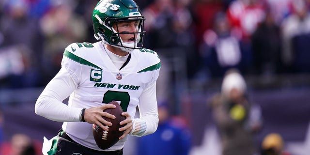 New York Jets quarterback Zach Wilson, #2, looks to pass against the New England Patriots in the first quarter at Gillette Stadium in Foxborough, Massachusetts, Nov. 20, 2022.