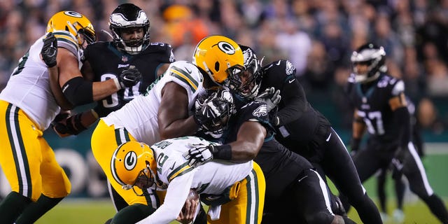 Fletcher Cox #91 of the Philadelphia Eagles sacks Aaron Rodgers #12 of the Green Bay Packers during the 2nd quarter at Lincoln Financial Field on November 27, 2022 in Philadelphia, Pennsylvania.