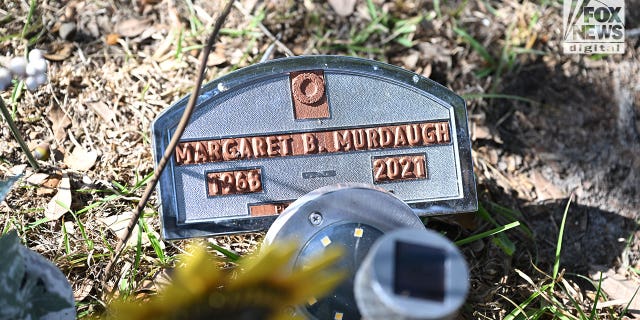 The temporary plastic plaque marking Maggie Murdaugh's grave at Hampton Cemetery, in South Carolina, 17 months after her husband, Alex Murdaugh, allegedly shot her and their 22-year-old son, Paul, to death. 