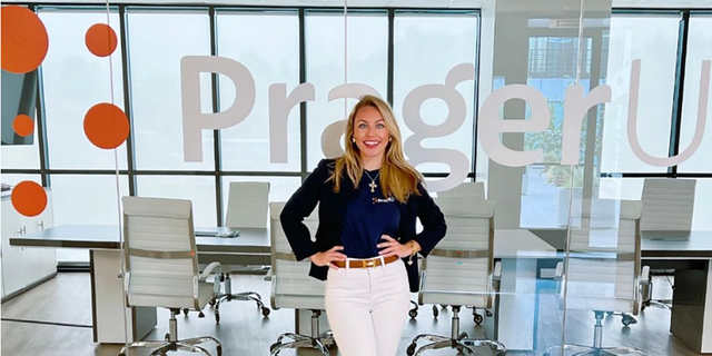 Annabella Rockwell poses for a photo at her new employer, PragerU. 