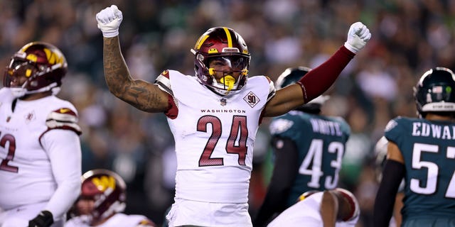 Antonio Gibson #24 of the Washington Commanders celebrates after scoring a touchdown against the Philadelphia Eagles during the first quarter in the game at Lincoln Financial Field on November 14, 2022 in Philadelphia, Pennsylvania.