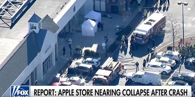 Police respond after a driver pulled into an Apple store in Massachusetts on November 21, 2022.