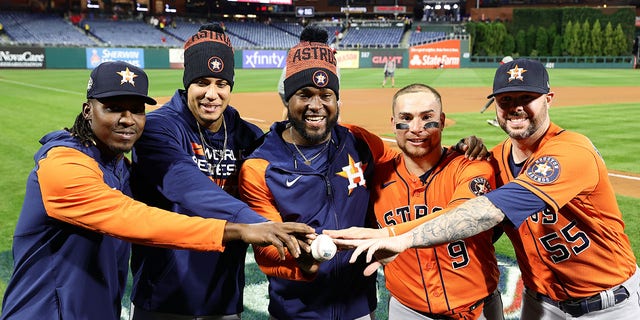 Rafael Montero, left, Bryan Abreu, Cristian Javier, Christian Vázquez and Ryan Pressly of the Houston Astros pose for a photo after their combined no-hitter against the Philadelphia Phillies in Game 4 of the World Series, Nov. 2, 2022, in Philadelphia.