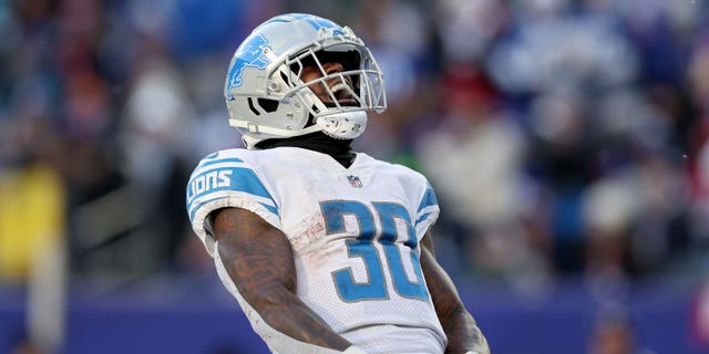 Jamaal Williams of the Detroit Lions celebrates after scoring a touchdown against the New York Giants during the third quarter at MetLife Stadium on Nov. 20, 2022, in East Rutherford, New Jersey.