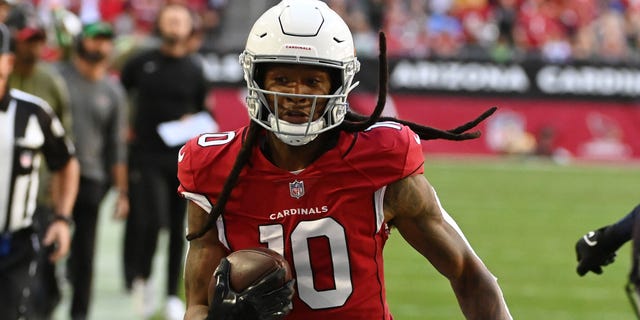 DeAndre Hopkins #10 of the Arizona Cardinals runs with the ball against the Seattle Seahawks at State Farm Stadium on November 06, 2022 in Glendale, Arizona.