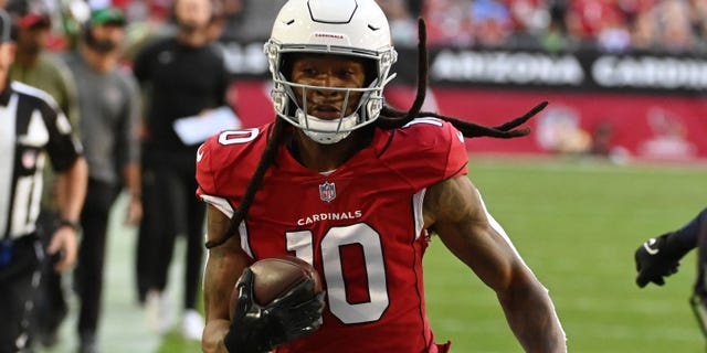 DeAndre Hopkins #10 of the Arizona Cardinals runs with the ball against the Seattle Seahawks at State Farm Stadium on November 6, 2022 in Glendale, Arizona.