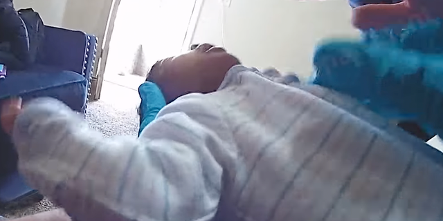 Body cam footage showing officer helping revive baby who stopped breathing.