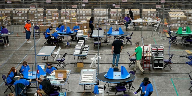 Maricopa County ballots cast in the 2020 general election are being examined and counted by contractors in Phoenix, Arizona, on May 6, 2021. 