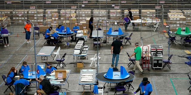 Maricopa County ballots cast in the 2020 general election are being examined and counted by contractors in Phoenix, Arizona, on May 6, 2021.