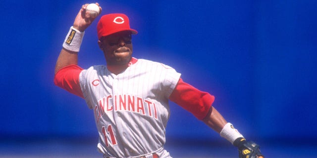 Barry Larkin of the Cincinnati Reds fields a ground ball during a game against the New York Mets April 23, 1997, at Shea Stadium in New York City. 