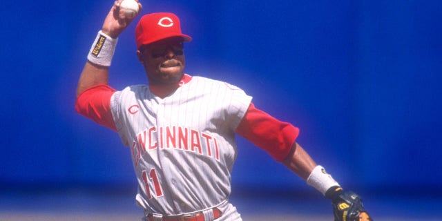 Barry Larkin of the Cincinnati Reds fields a ground ball during a game against the New York Mets April 23, 1997, at Shea Stadium in New York City. 