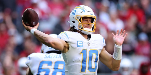 Justin Herbert of the Los Angeles Chargers throws a pass in the first quarter against the Arizona Cardinals at State Farm Stadium on Nov. 27, 2022, in Glendale, Arizona.