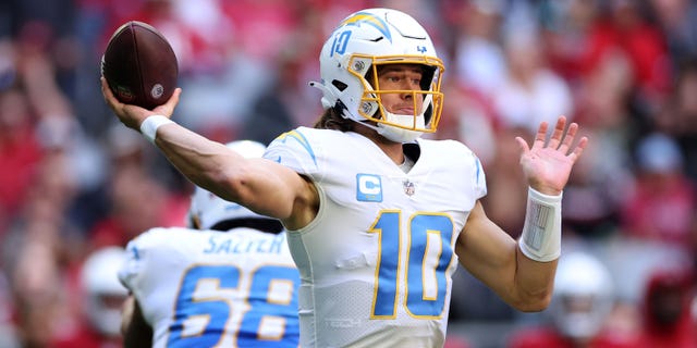 Justin Herbert of the Los Angeles Chargers throws a pass in the first quarter against the Arizona Cardinals at State Farm Stadium on Nov. 27, 2022, in Glendale, Arizona.