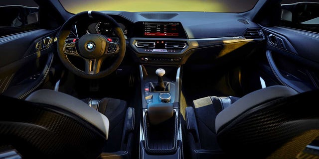 The interior of the 3.0 CSL features racing-style seats and a large mushroom-shaped handle on its shifter.