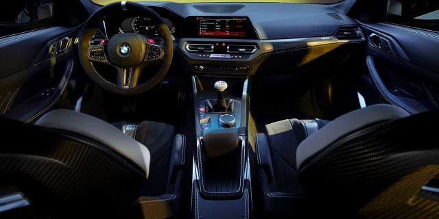 The interior of the 3.0 CSL features racing-style seats and a large mushroom-shaped handle on its shifter.