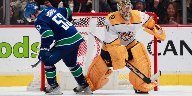 Vancouver Canucks Bo Horvat (53) beats Nashville Predators goaltender Juuse Saros after losing the puck during a shootout at Rogers Arena on November 5, 2022 in Vancouver, British Columbia, Canada.