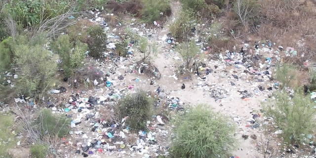Texas drone footage shows heaps of discarded trash and clothing at