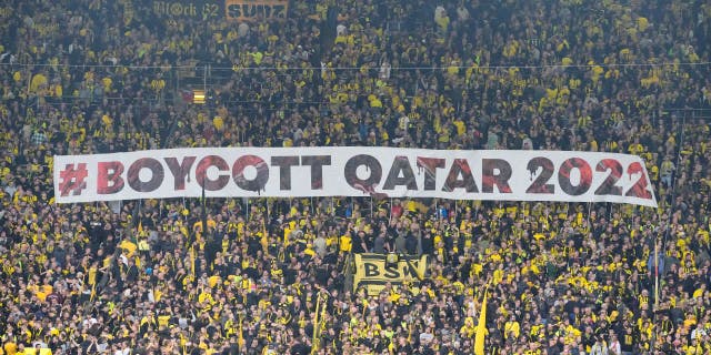 Fans display a banner during a German Bundesliga soccer match between Borussia Dortmund and VfB Stuttgart in Dortmund, Germany, Oct.