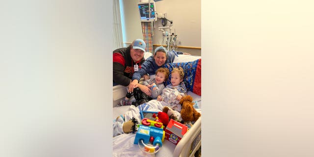 The Blicher family visited their son Bennett (right), who is still in the hospital fighting a virus.