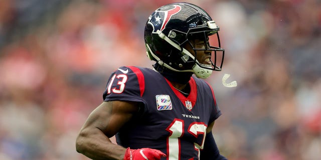 Brandin Cooks, #13 of the Houston Texans, reacts after hauling a catch in the first quarter against the Los Angeles Chargers at NRG Stadium on October 2, 2022 in Houston.