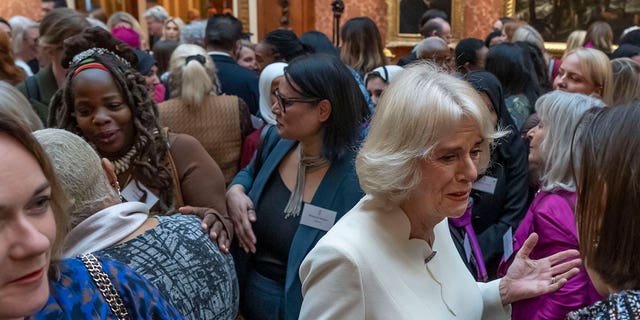 Charity leader Ngozi Fulani, center left, attends a reception to raise awareness of violence against women and girls in Buckingham Palace, London, on Nov. 29, 2022. 
