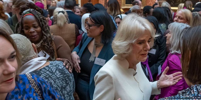 Charity leader Ngozi Fulani, center left, attends a reception to raise awareness of violence against women and girls in Buckingham Palace, London, on Nov. 29, 2022.