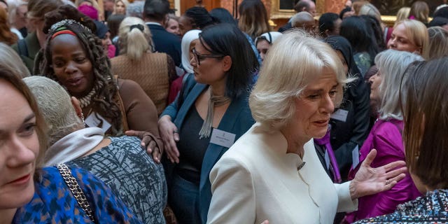 Charity leader Ngozi Fulani, center left, attends a reception to raise awareness of violence against women and girls in Buckingham Palace, London, on Nov. 29, 2022. 