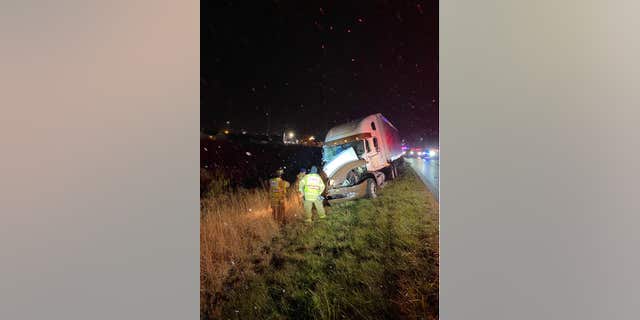 The truck driver came to a stop about an eighth of a mile down the road.