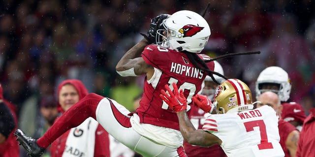 DeAndre Hopkins #10 of the Arizona Cardinals catches Charvarius Ward #7 of the San Francisco 49ers during the first half at Estadio Azteca on November 21, 2022 in Mexico City, Mexico.