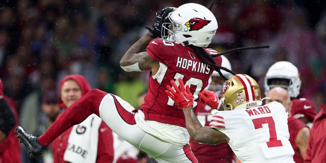 DeAndre Hopkins #10 of the Arizona Cardinals catches Charvarius Ward #7 of the San Francisco 49ers during the first half at Estadio Azteca on November 21, 2022 in Mexico City, Mexico.