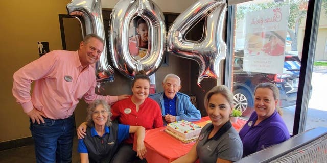 Employees at the Chick-fil-A location in Oldsmar, Fla., celebrate the 104th birthday of longtime regular Mr. Steve.