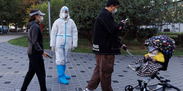 Chinese citizens line up for swab tests amid the nation's ongoing battle against the COVID pandemic, with many restrictions still in place despite much of the world gradually easing them.