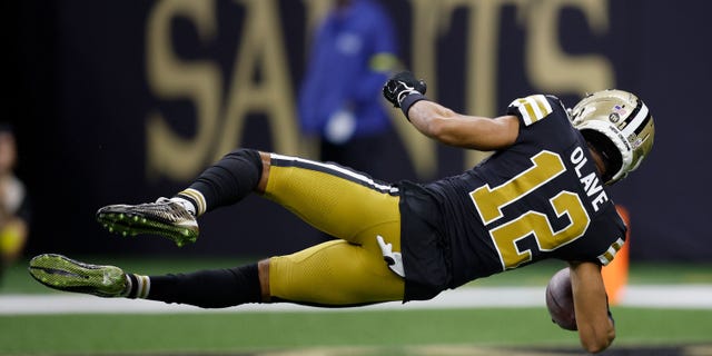 Chris Olave of the New Orleans Saints scores a touchdown against the Los Angeles Rams during the third quarter at Caesars Superdome on Nov. 20, 2022, in New Orleans.