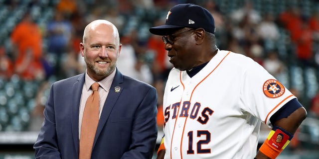 General manager James Click and manager Dusty Baker Jr. #12 talk at Minute Maid Park on April 18, 2022, in Houston, Texas. 