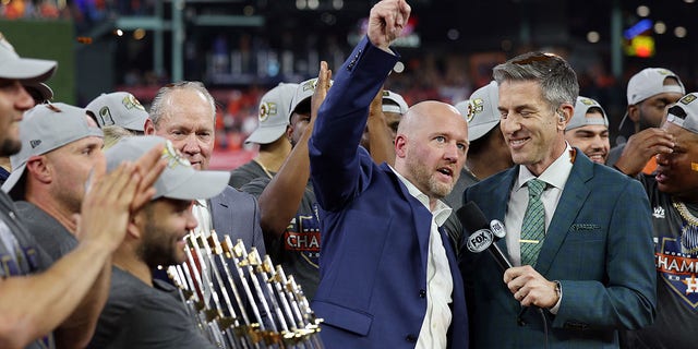 Houston Astros general manager James Click raises his arm following a 4-1 victory in Game 6 to win the World Series at Minute Maid Park on November 5, 2022, in Houston.